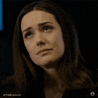 An animated GIF of a woman with a disappointed look on her face, shaking her head no